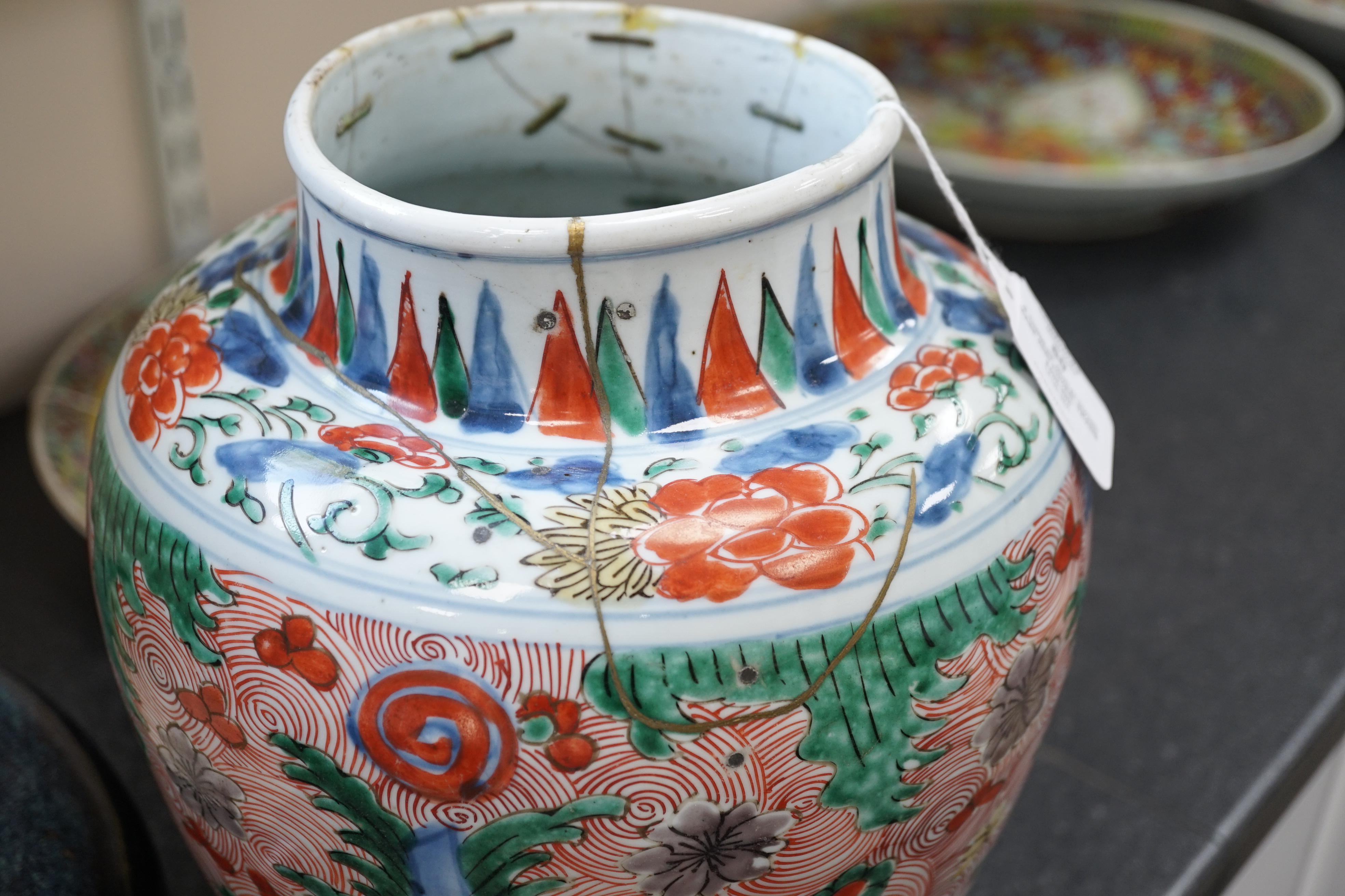 A Chinese wucai ovoid vase and cover, Transitional, Shunzhi period, broken with kintsugi style repair